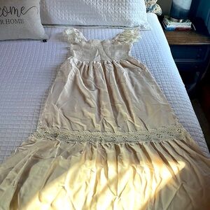 New, never worn cream sun dress with lining.